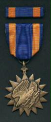 Air Medal with ribbon bar showing Eagle with Lightning Bolts